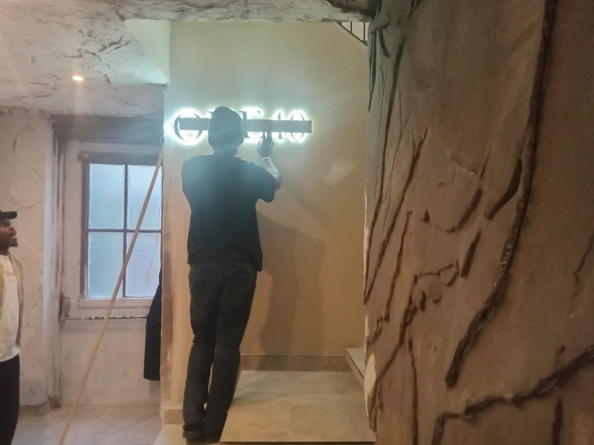 Sign installation in progress by Just Art Creative Warehouse Cape Town